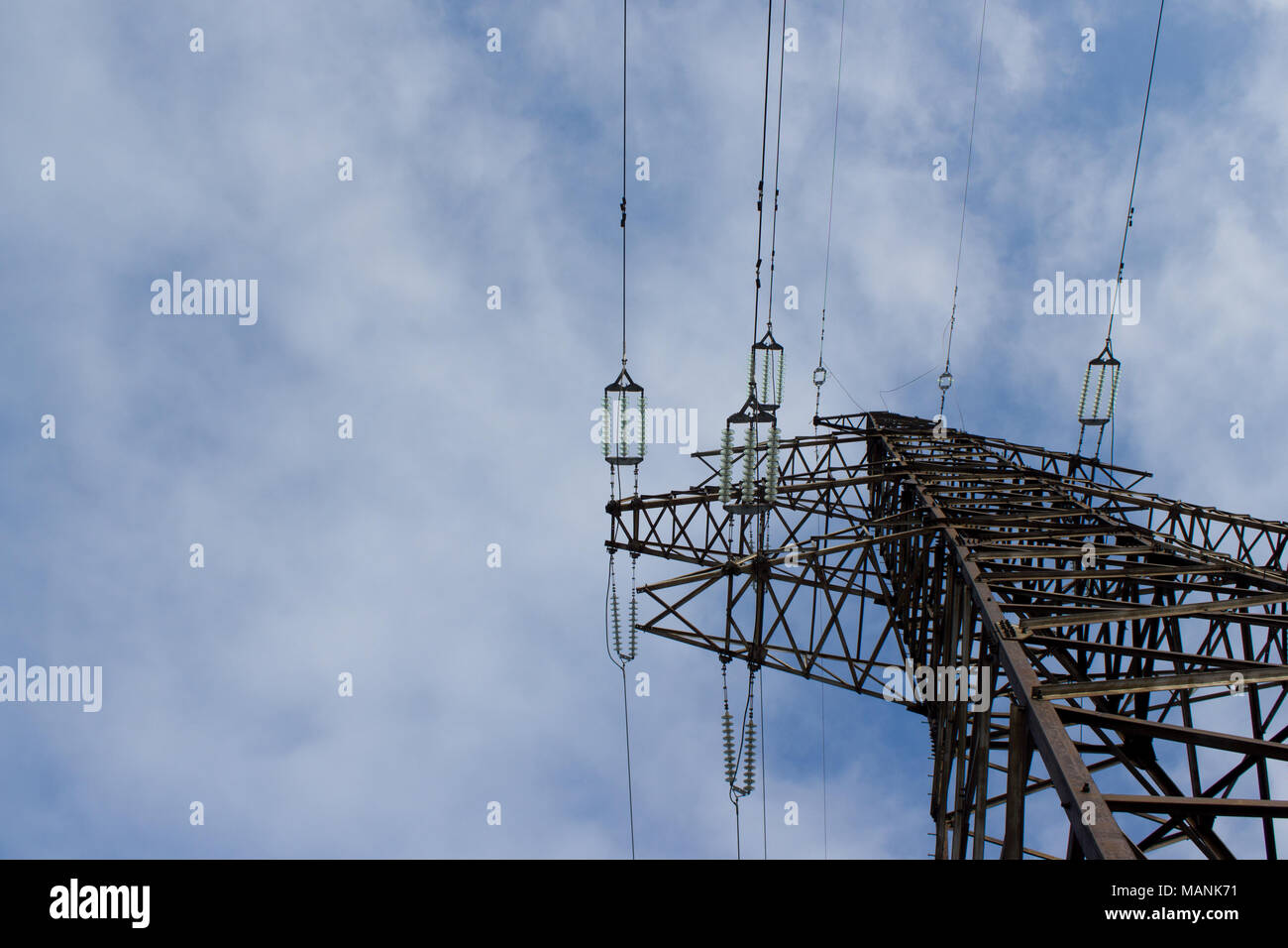 High voltage line on blue sky background Stock Photo - Alamy