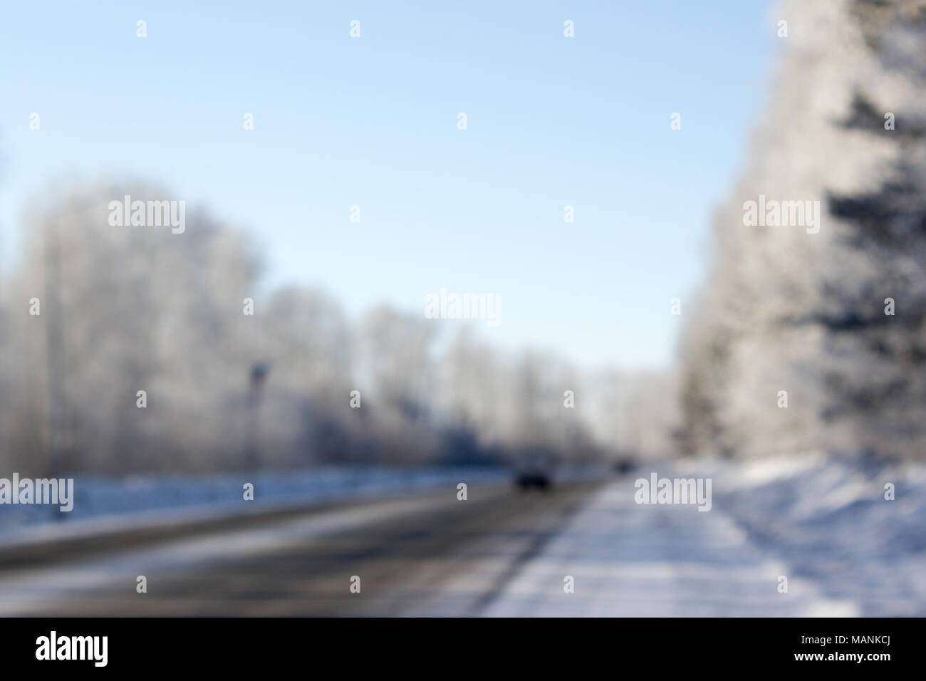 Winter road with tire tracks in the snow Stock Photo - Alamy
