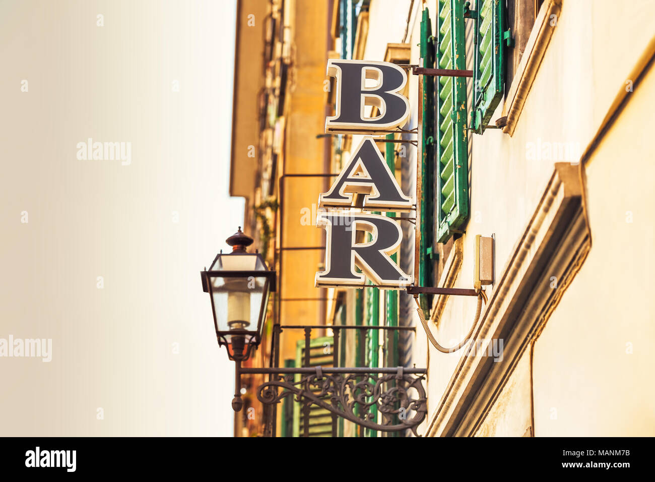 Vintage bar sign on a street of the city Stock Photo - Alamy