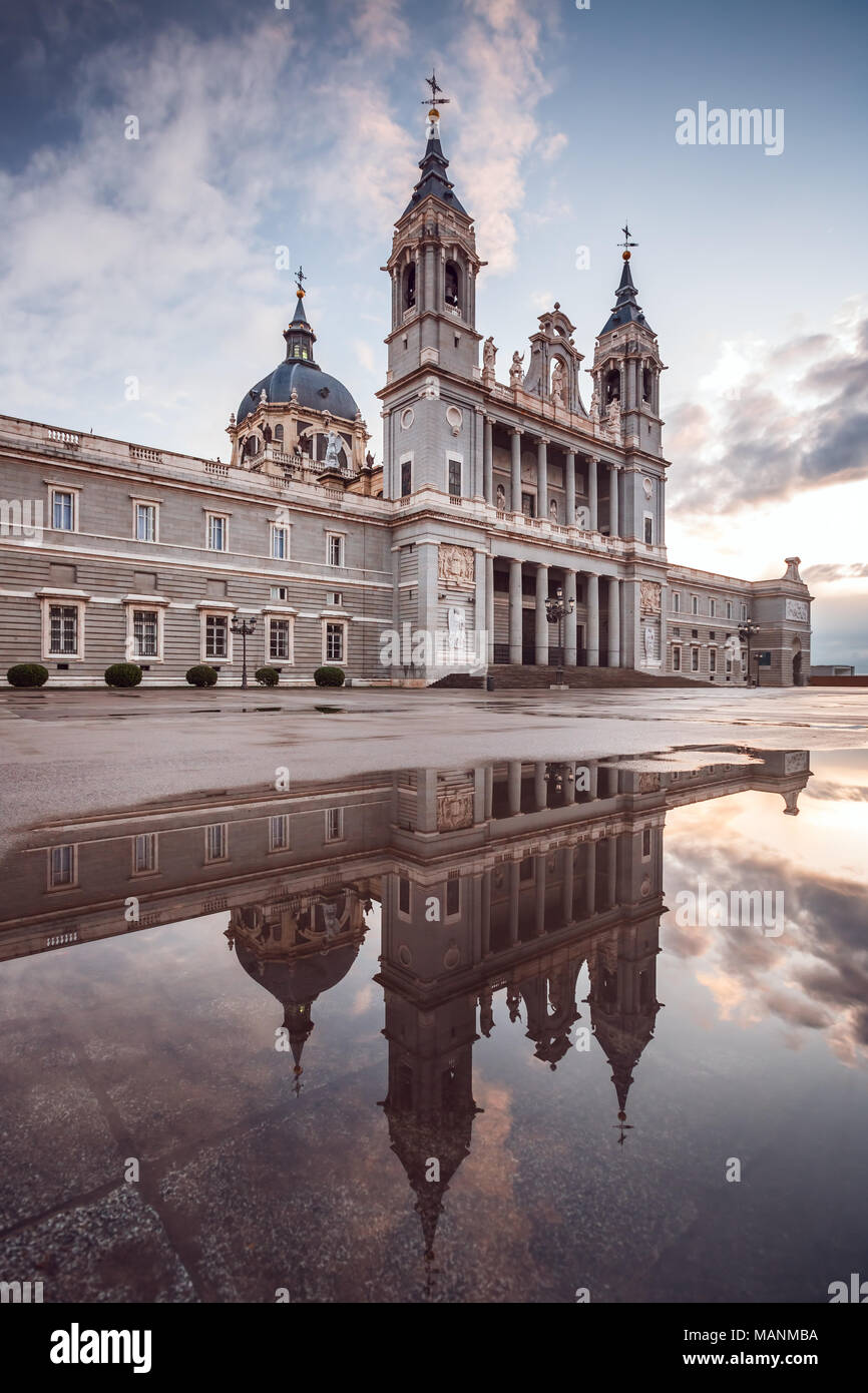 View of the Almudena Cathedral in Madrid, Spain. Reflection on a puddle. Stock Photo
