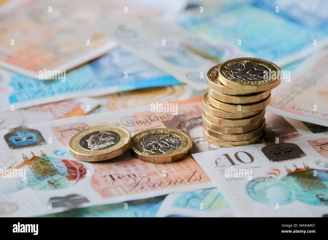 UK Sterling Currency - new notes and coins for 2018. new £1 coins and £5 and £10 notes currency for 2018 Stock Photo