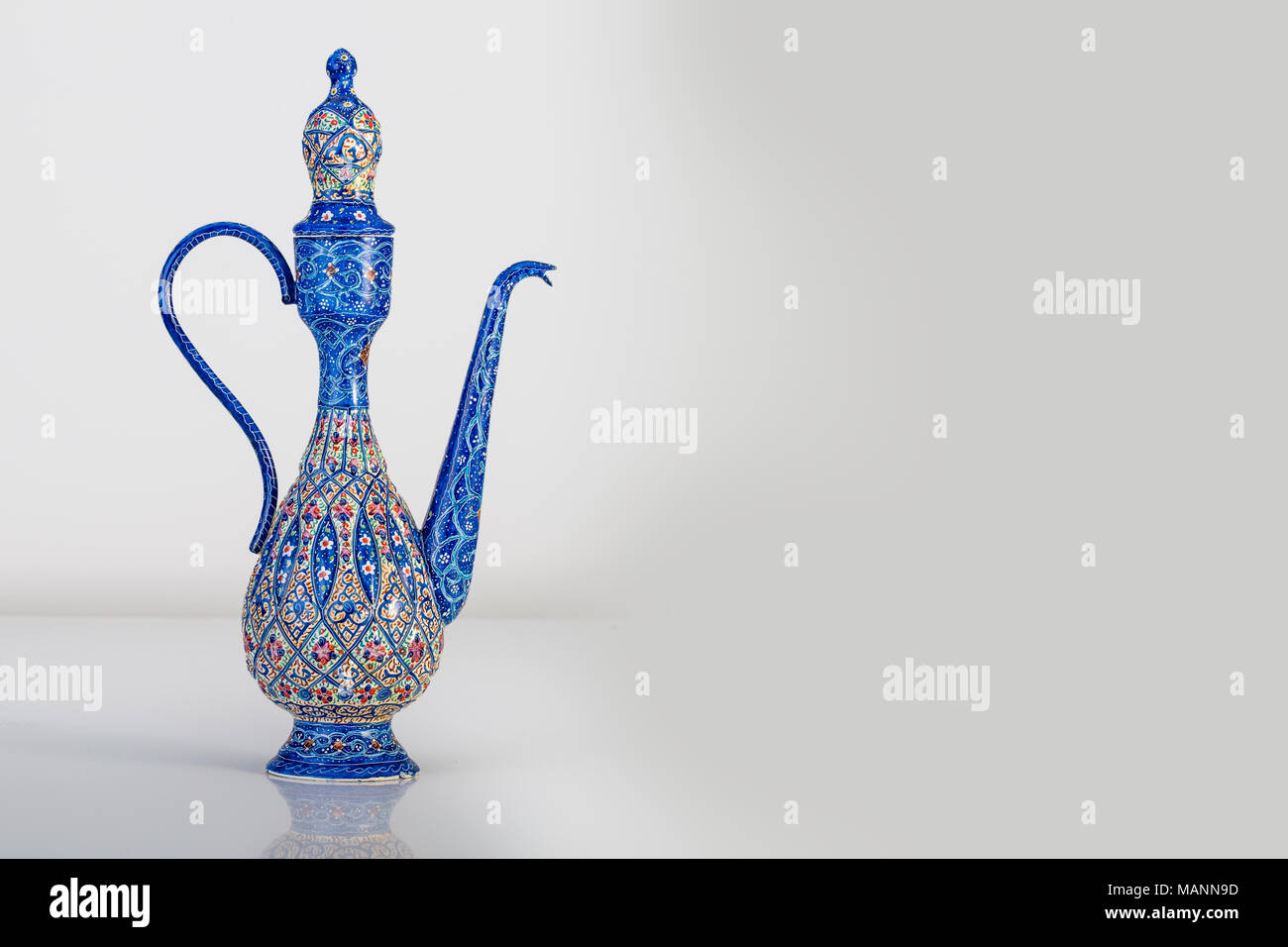Persian Rosewater Bottle Container With Enameling  (Minakari) Design handcrafted With Azure Blue Colors And Ornaments Patterns On The Surface Of Metal Stock Photo