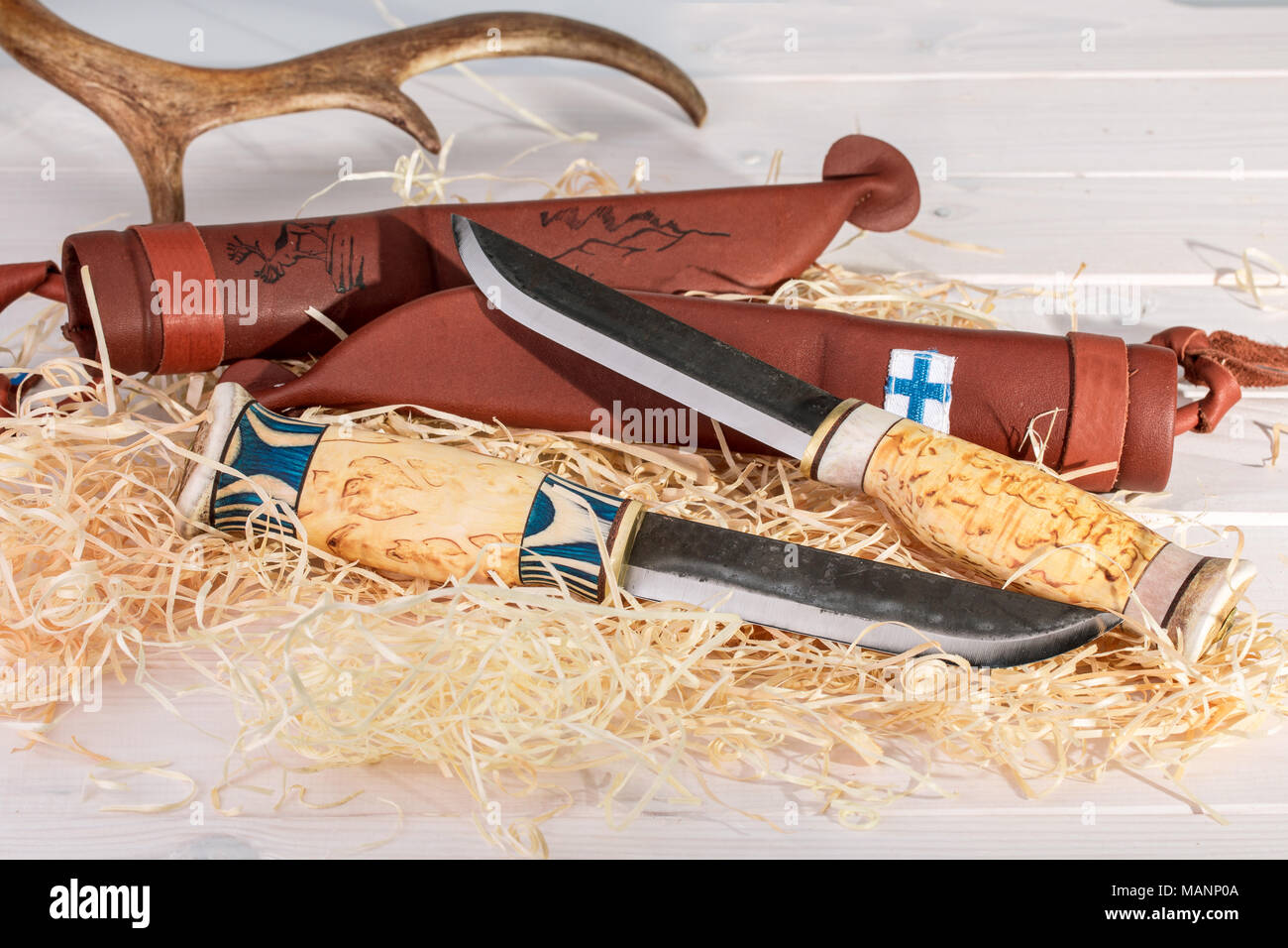 Traditional Finnish Belt Knives (Puukko) With Curving Cutting Edge And Leather Sheath Hand Crafted From Wood, Reindeer Horn And Steel, Finland's 100 Y Stock Photo