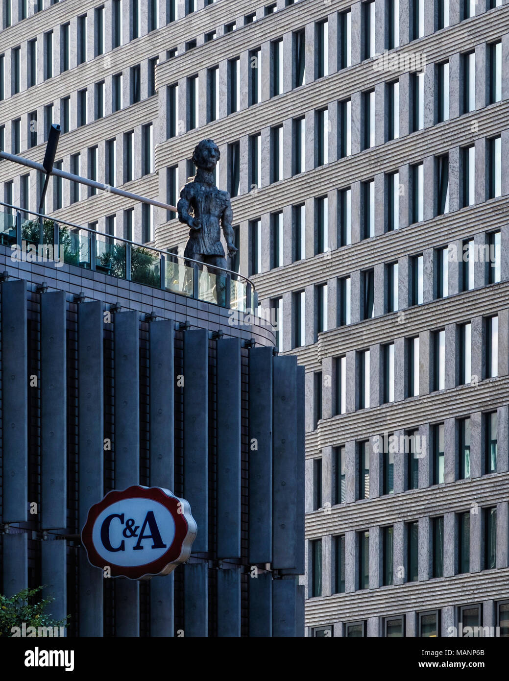 Berlin Charlottenburg,Swissôtel Luxury 5-star hotel overlooks Kurfürstendamm with sculpture on restaurant terrace & C&A retail store logo.             Stock Photo