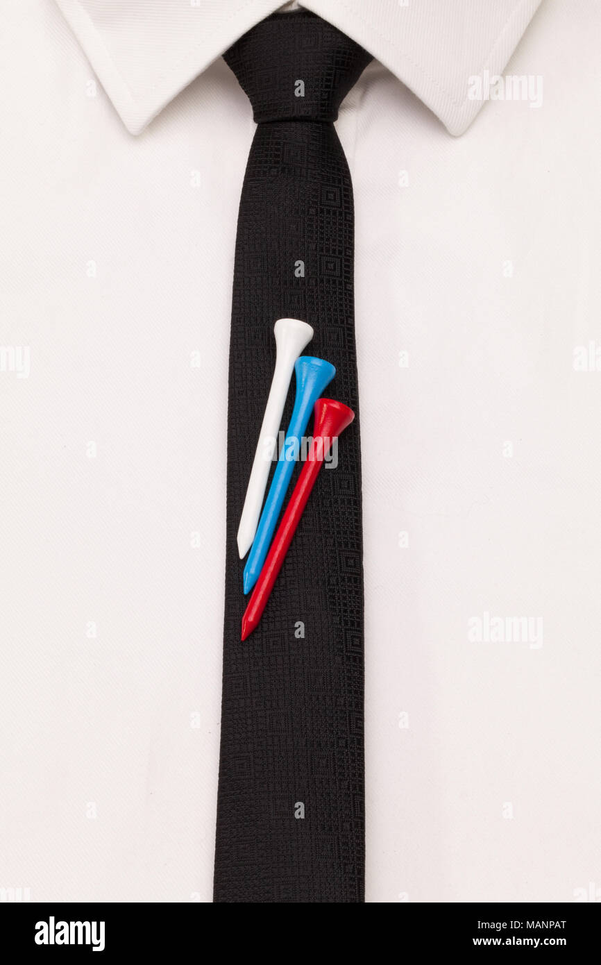 The detail of white shirt and black tie with golf design. Golf tees in the color of the Russian flag on the black tie. Stock Photo