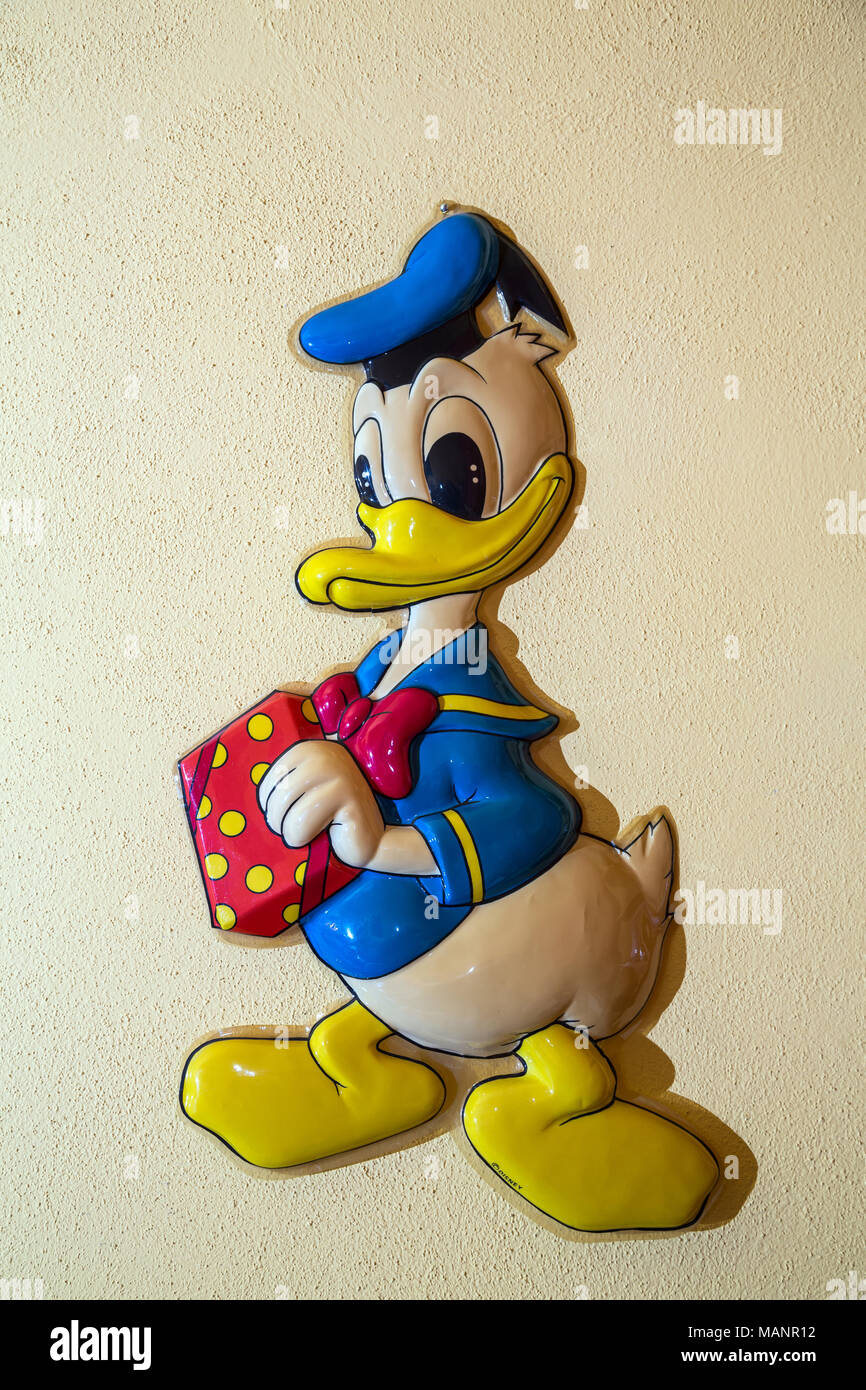 Posen, Poland, Donald Duck figure hanging on the wall of a living room Stock Photo