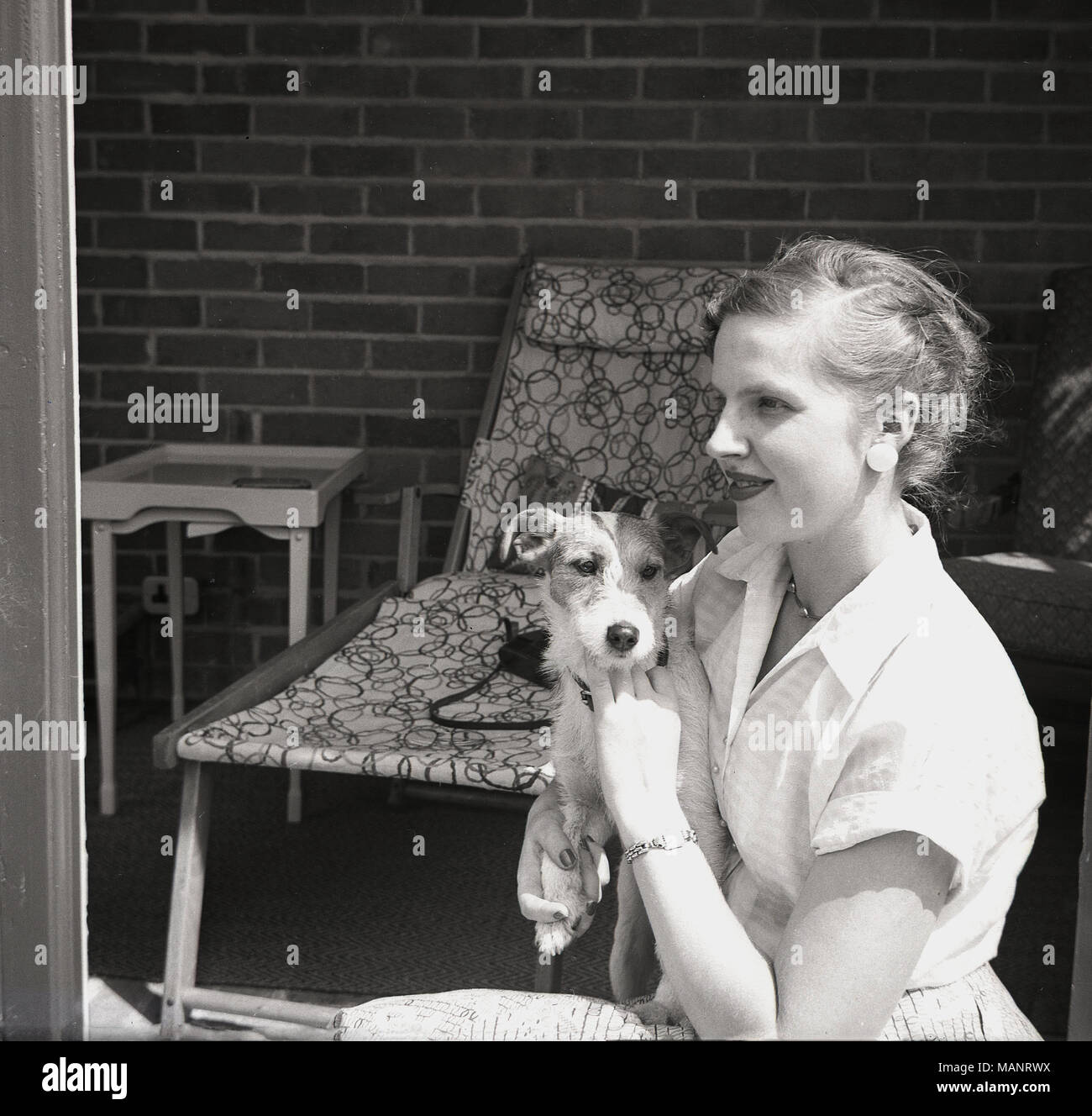 1951, historical, a female member of the Bonham -Carter family with her pet dog, England, UK. Stock Photo