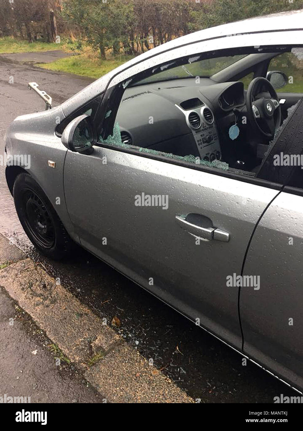 This Vauxhall Corsa had its bonnet, grille and lights stolen overnight between Good Friday and Easter Saturday whilst parked outside its owner's house in Chester-le-Street, County Durham. The vehicle is the latest example of the so-called Corsa Cannibals phenomenon where criminals strip entire parts from the popular hatchback's bodywork. Stock Photo