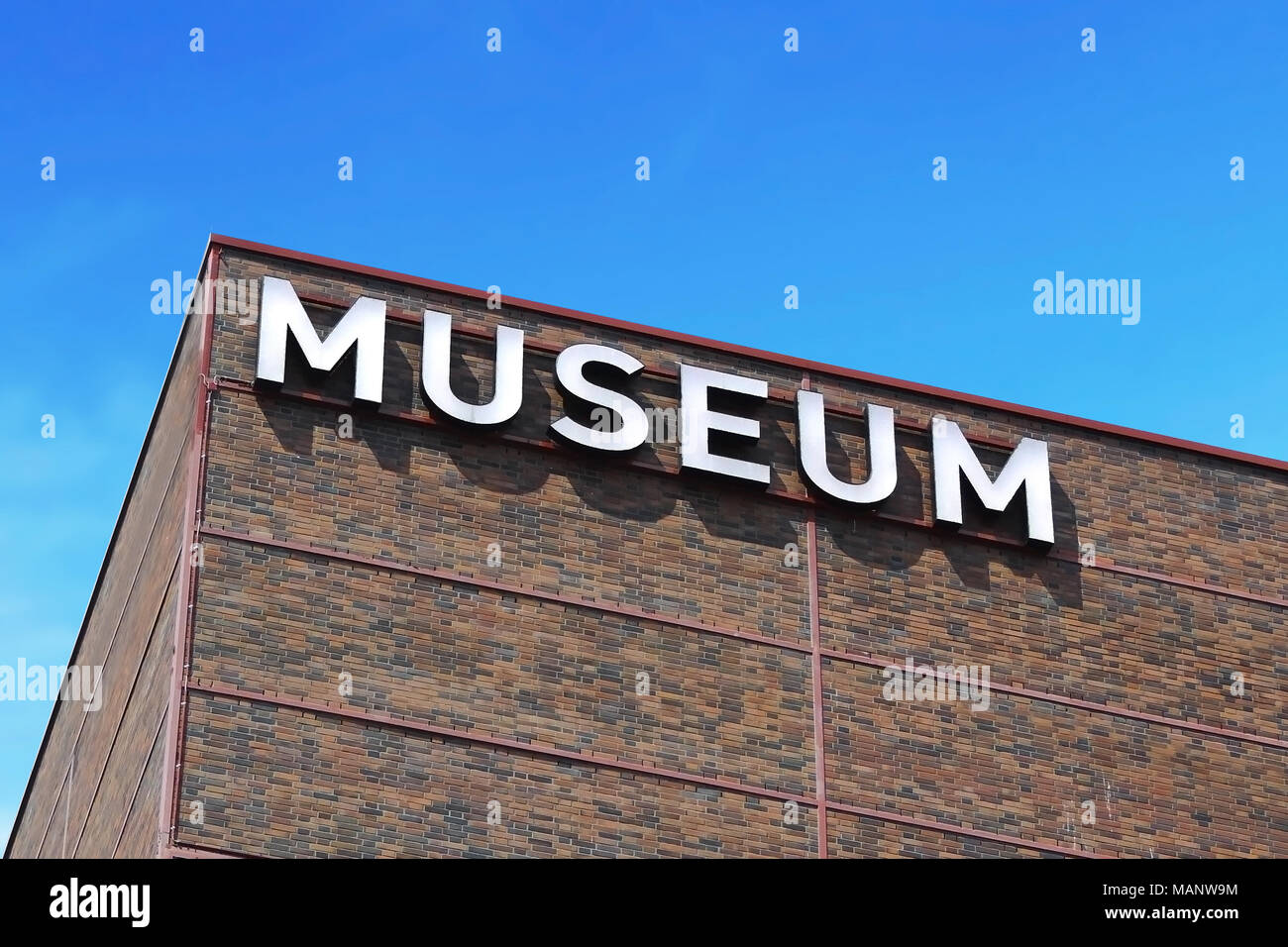 Building exterior of a museum with text or museum letters. House facade. Stock Photo
