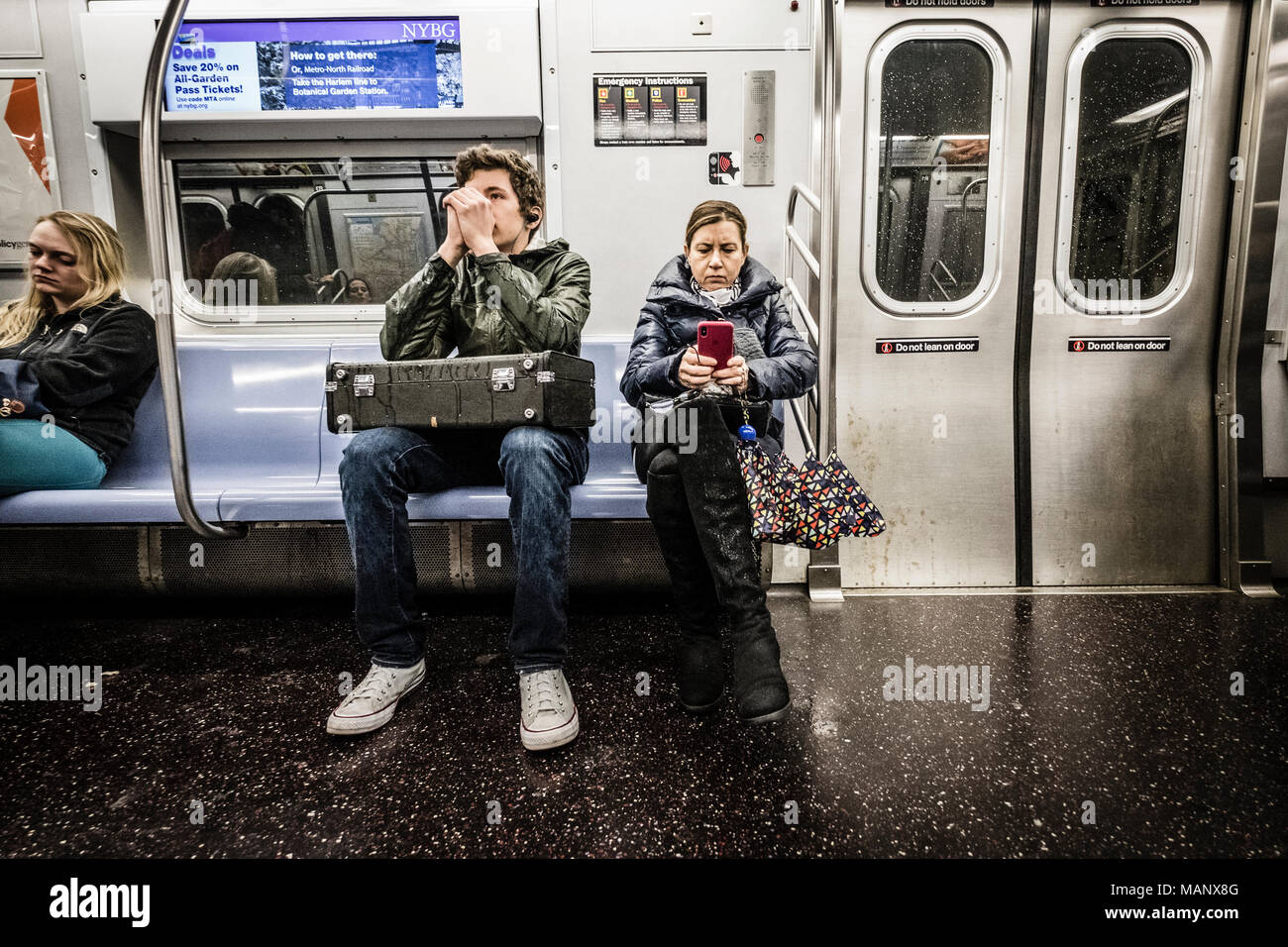 Commuters in subway wagon at New York subway system Stock Photo - Alamy