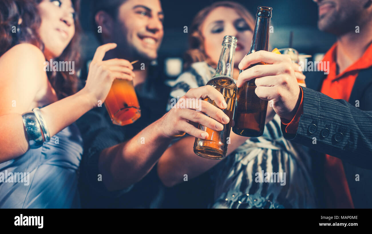 People with cocktails and beer in bar or club Stock Photo Alamy