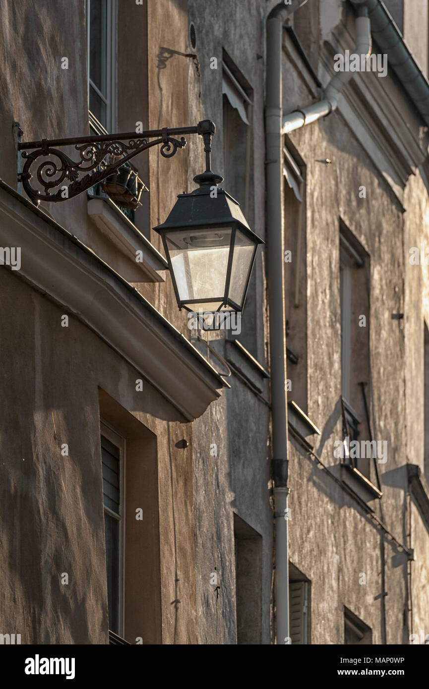 RUE MOUFFETARD, PARIS, FRANCE:  Vintage lamp on wall of old building Stock Photo