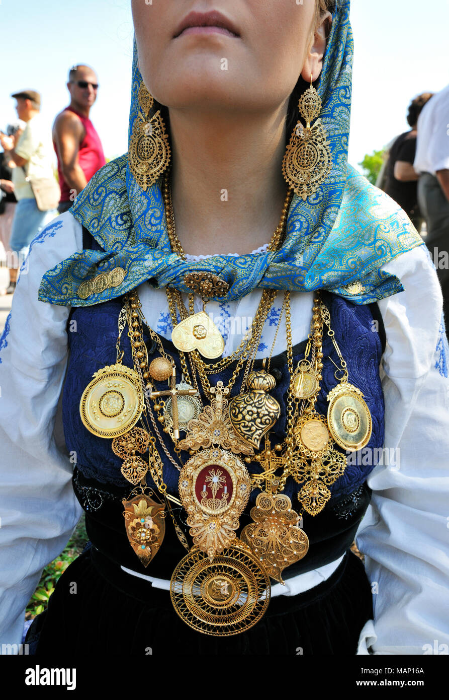 Gold necklace and traditional costume of Minho. Our Lady of Agony Festivities, the biggest traditional festival in Portugal. Viana do Castelo. Stock Photo