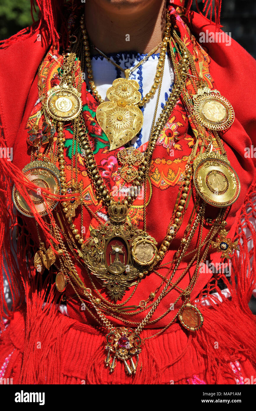 Gold necklace and traditional costume (Lavradeira) of Minho. Our Lady of Agony Festivities, the biggest traditional festival in Portugal. Viana do Cas Stock Photo