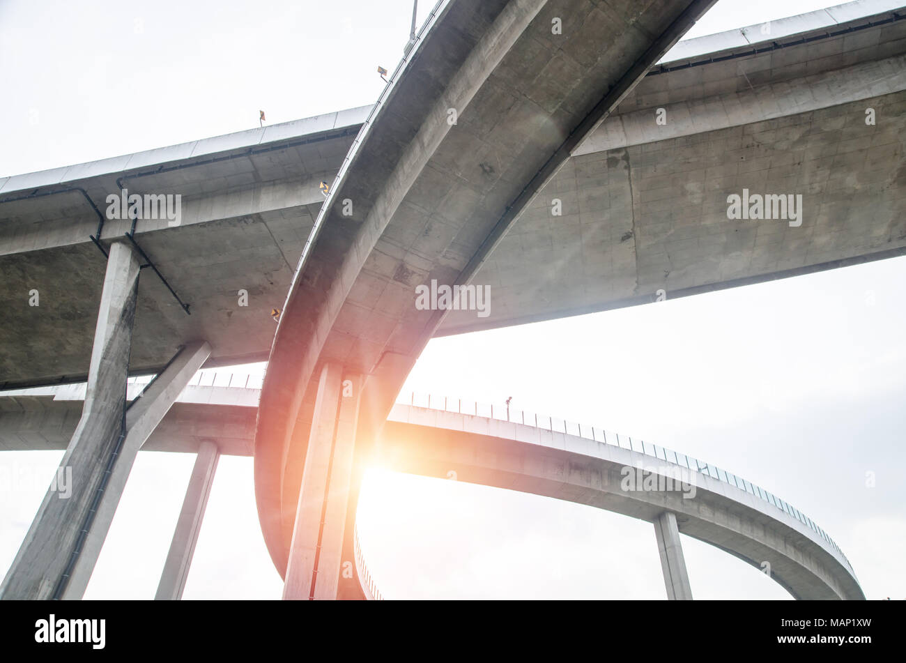 Elevated expressway . The curve of suspension bridge Large elevated traffic highway in Bangkok, Thailand. Stock Photo