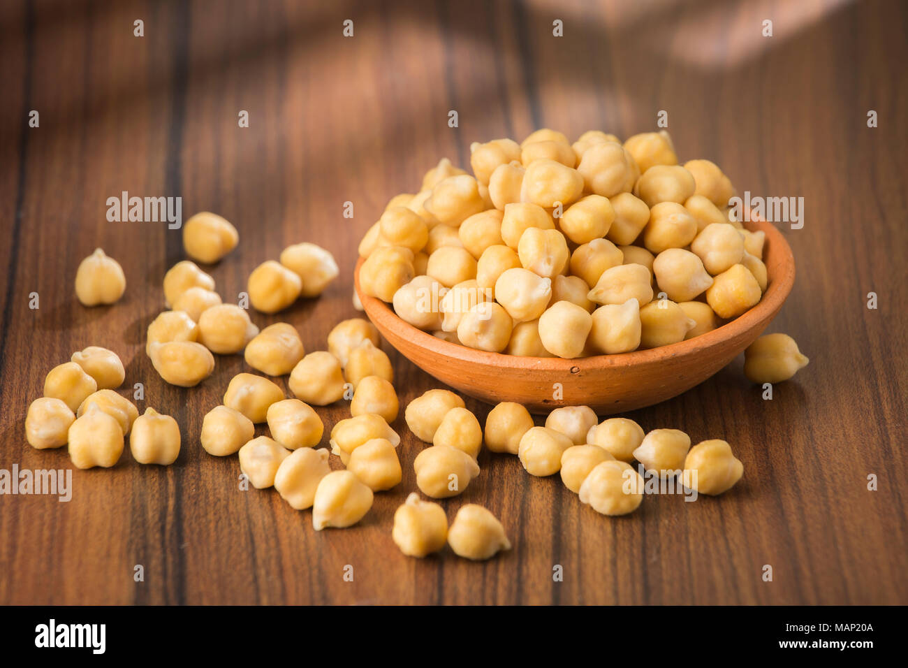 grains of chickpeas, (Cicer arietinum) in bowl on the table Stock Photo