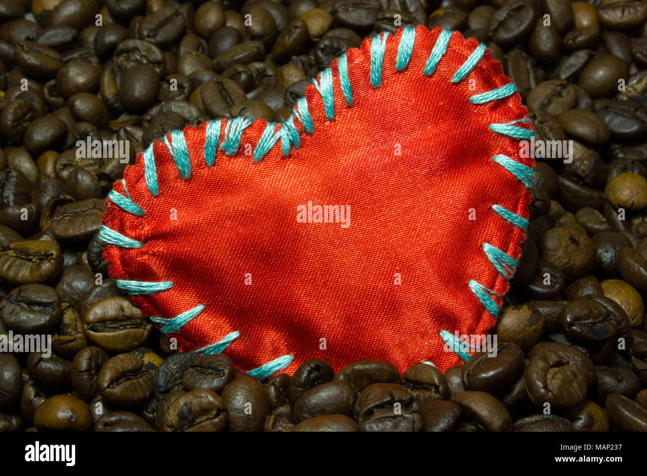 coffee-beans-and-a-red-love-heart-as-background-stock-photo-alamy