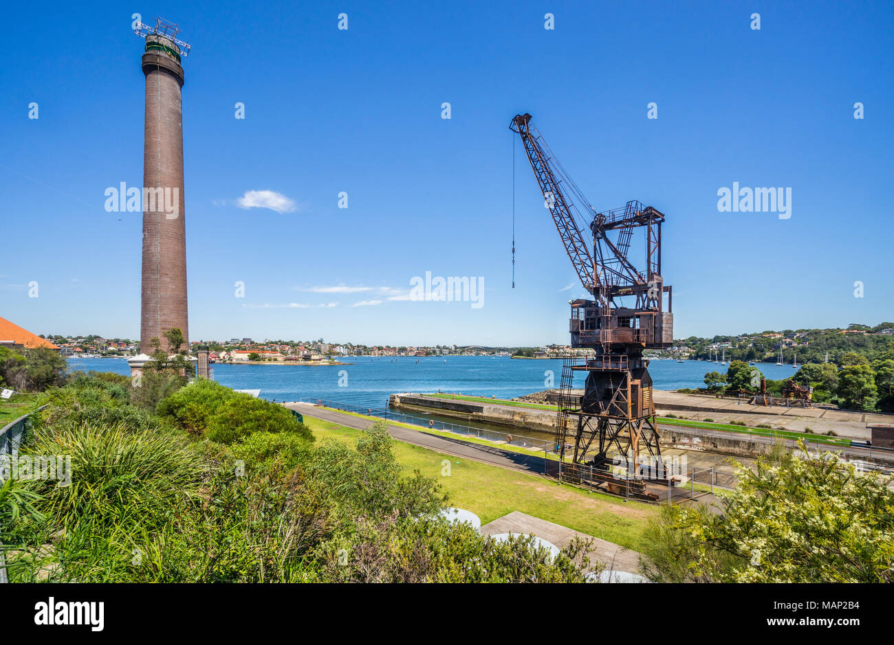shipyard crane at the slipway of Cockatoo Island shipyard heritage site against the backdrop of the powerhouse smoke stake, Sydney Harbour, New South  Stock Photo