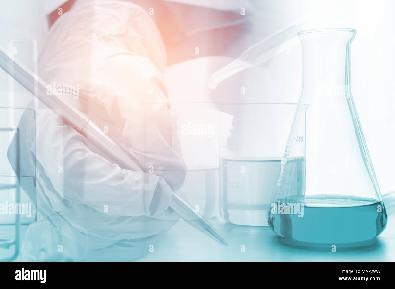 three erlenmeyer flask and microscope , Glassware on science laboratory research and development Stock Photo