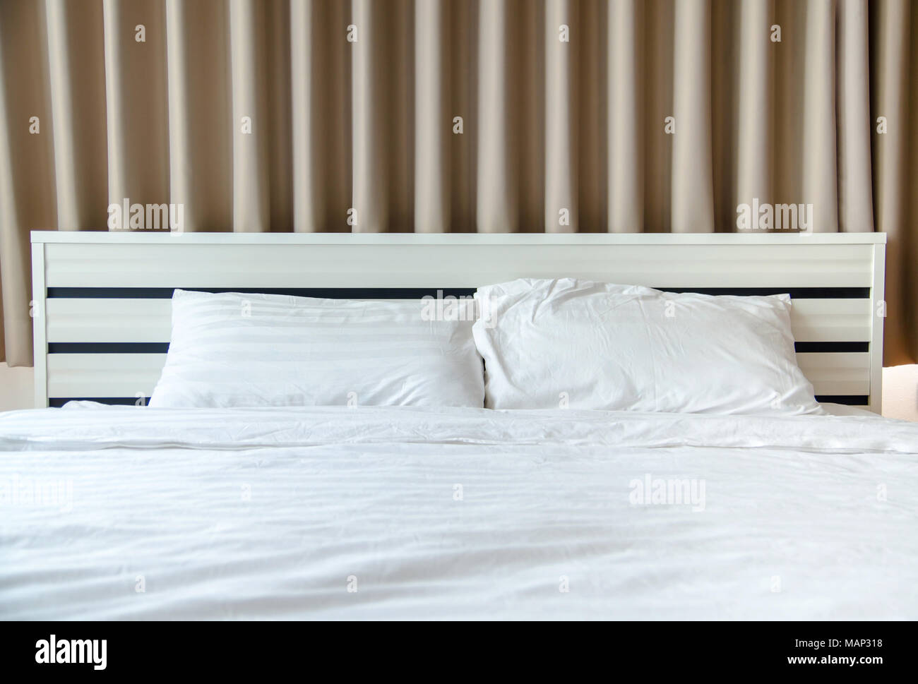 quilt bed white pillows on white bed in bedroom Stock Photo Alamy