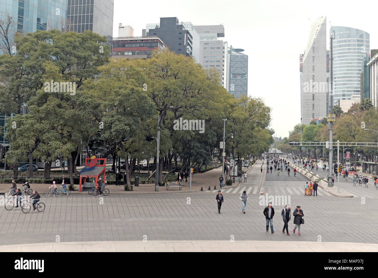 Pedestrians walk along the Paseo de la Reforma during the weekly Sunday morning car-free event giving the roads to walkers, bikers, and recreationists Stock Photo