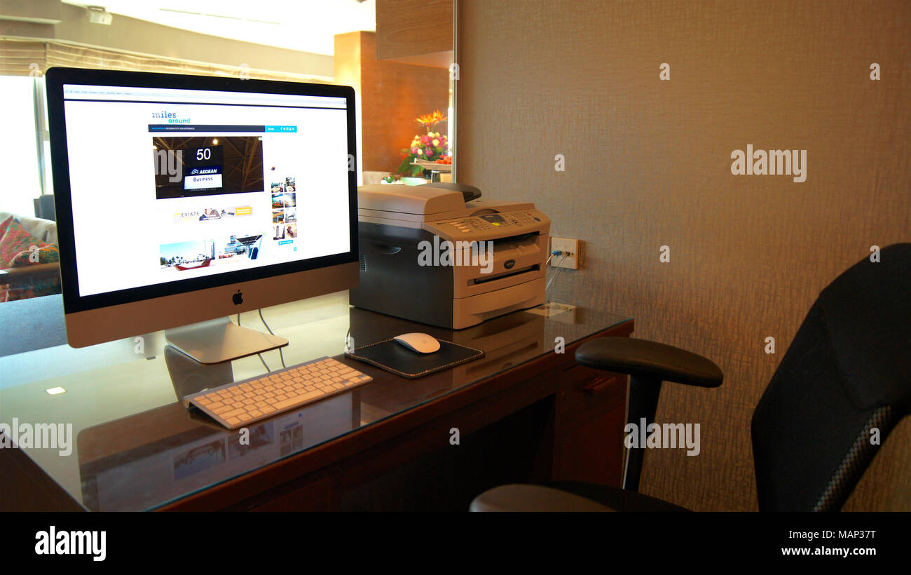 SINGAPORE - APR 2nd 2015: Computer on the table in a Business Center at a luxury hotel Stock Photo