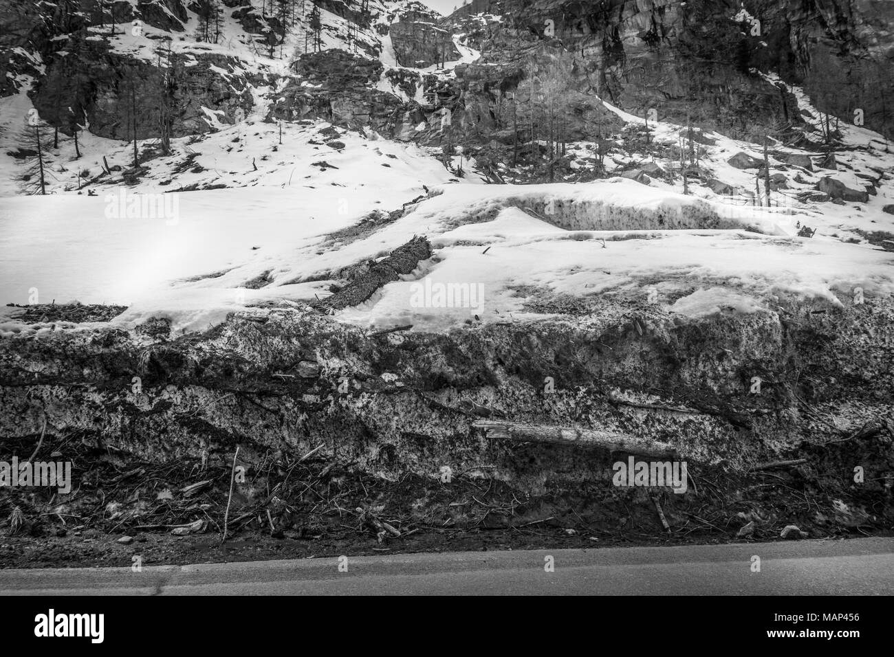 spring landscape in the mountains in black and white with snow. Bad ...