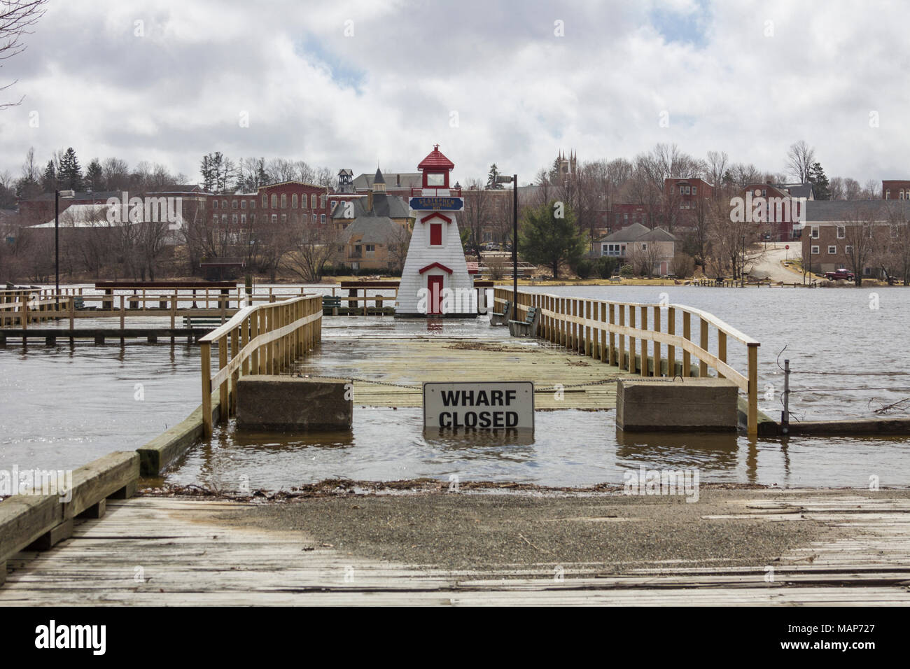 Flooding at king tide on the St. Croix river in St. Stephen, New Brunswick, Canada with water flooding the wharf Stock Photo