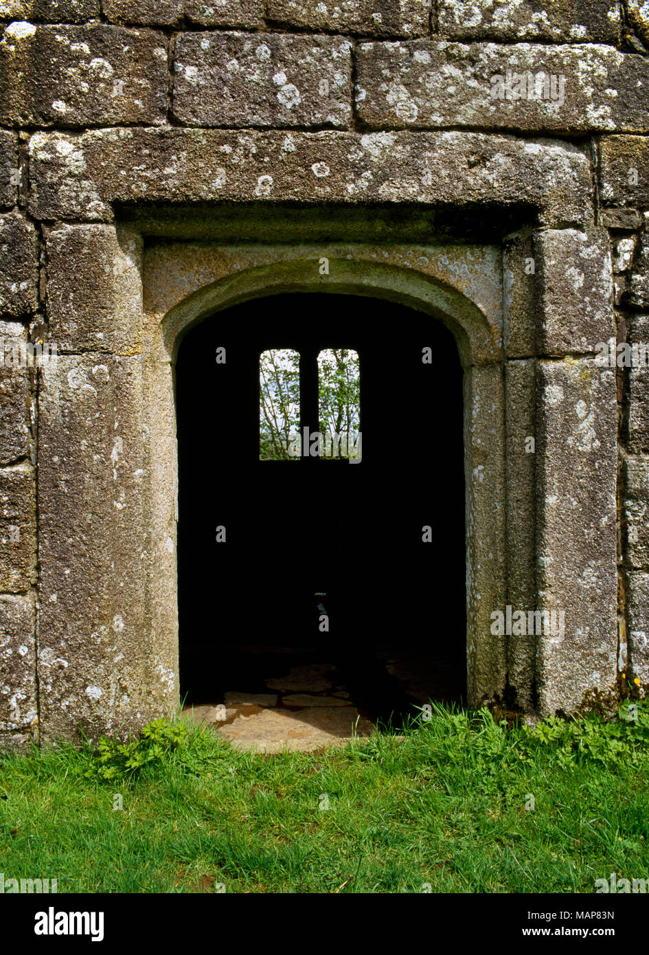 View E of doorway to late Medieval/Tudor granite well house at Dupath, Cornwall, UK, dedicated to St Dominick: built c 1500 over an ancient spring. Stock Photo