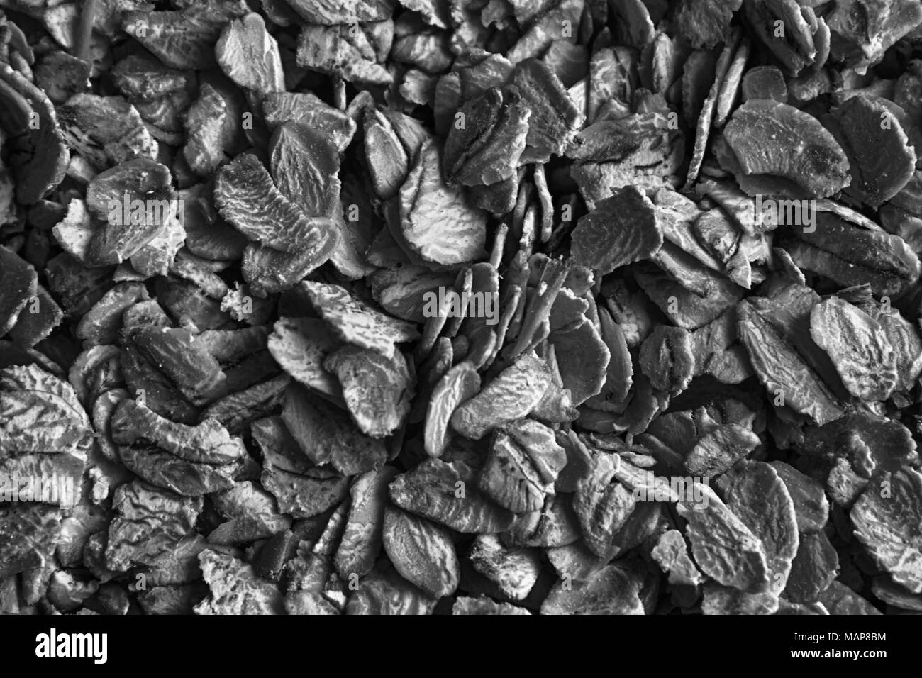 Monochrome texture of oatmeal. The concept of proper nutrition and healthy lifestyle. Top view, close-up as background or texture. Stock Photo