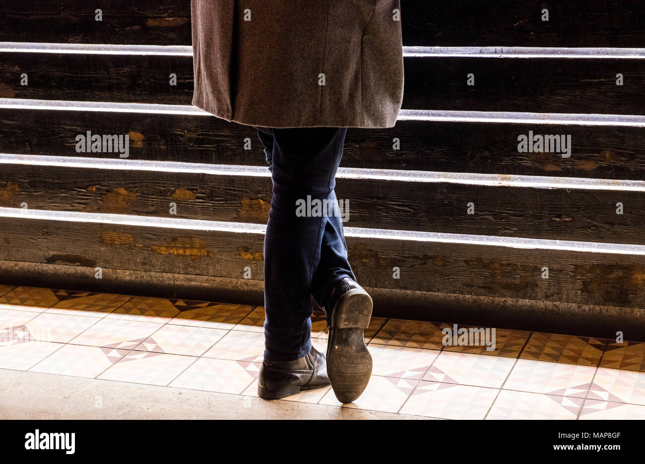Man standing by steps, low section Stock Photo - Alamy