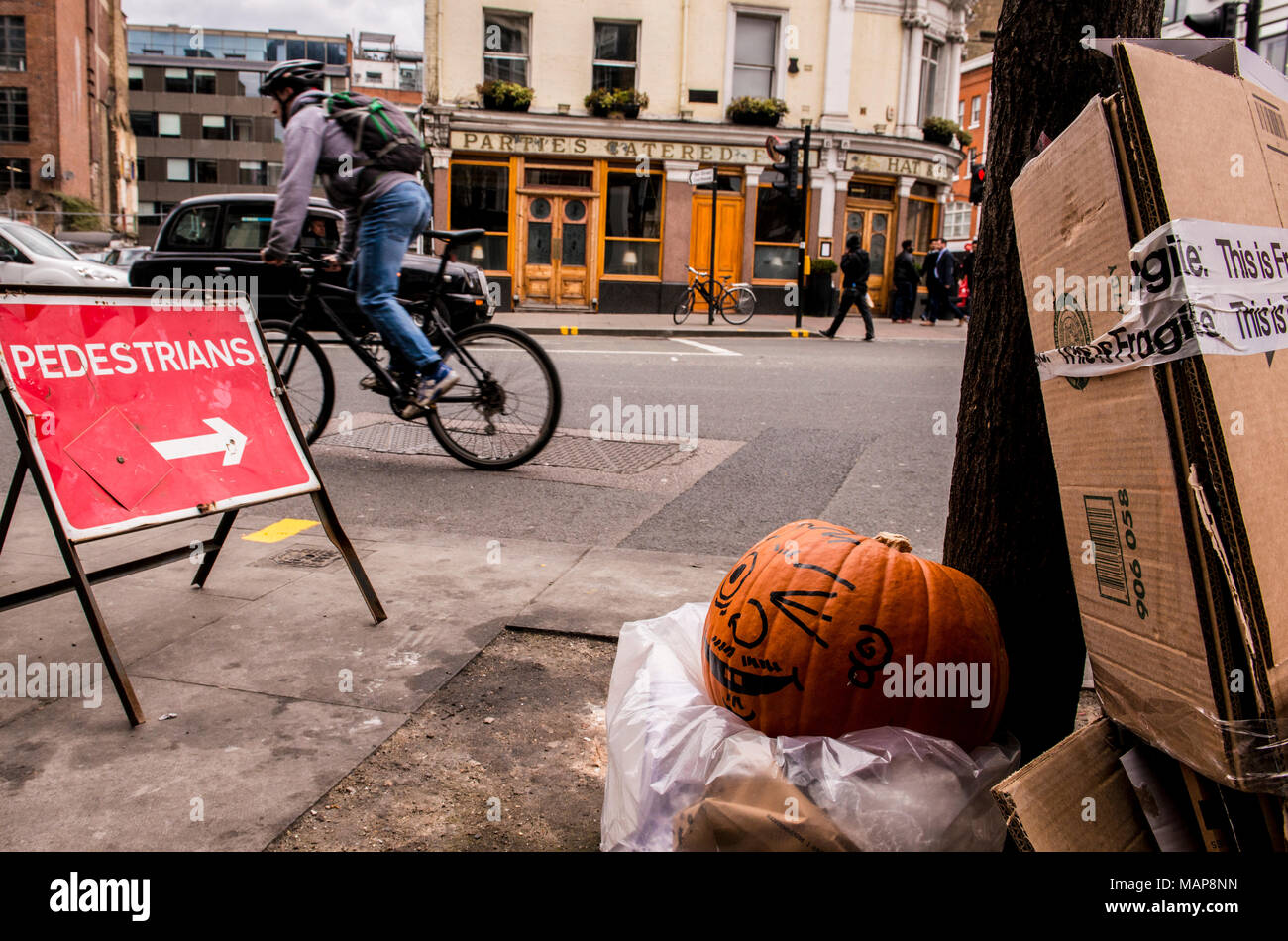 Street scene with man on bike, Farringdon, London, England UK Stock