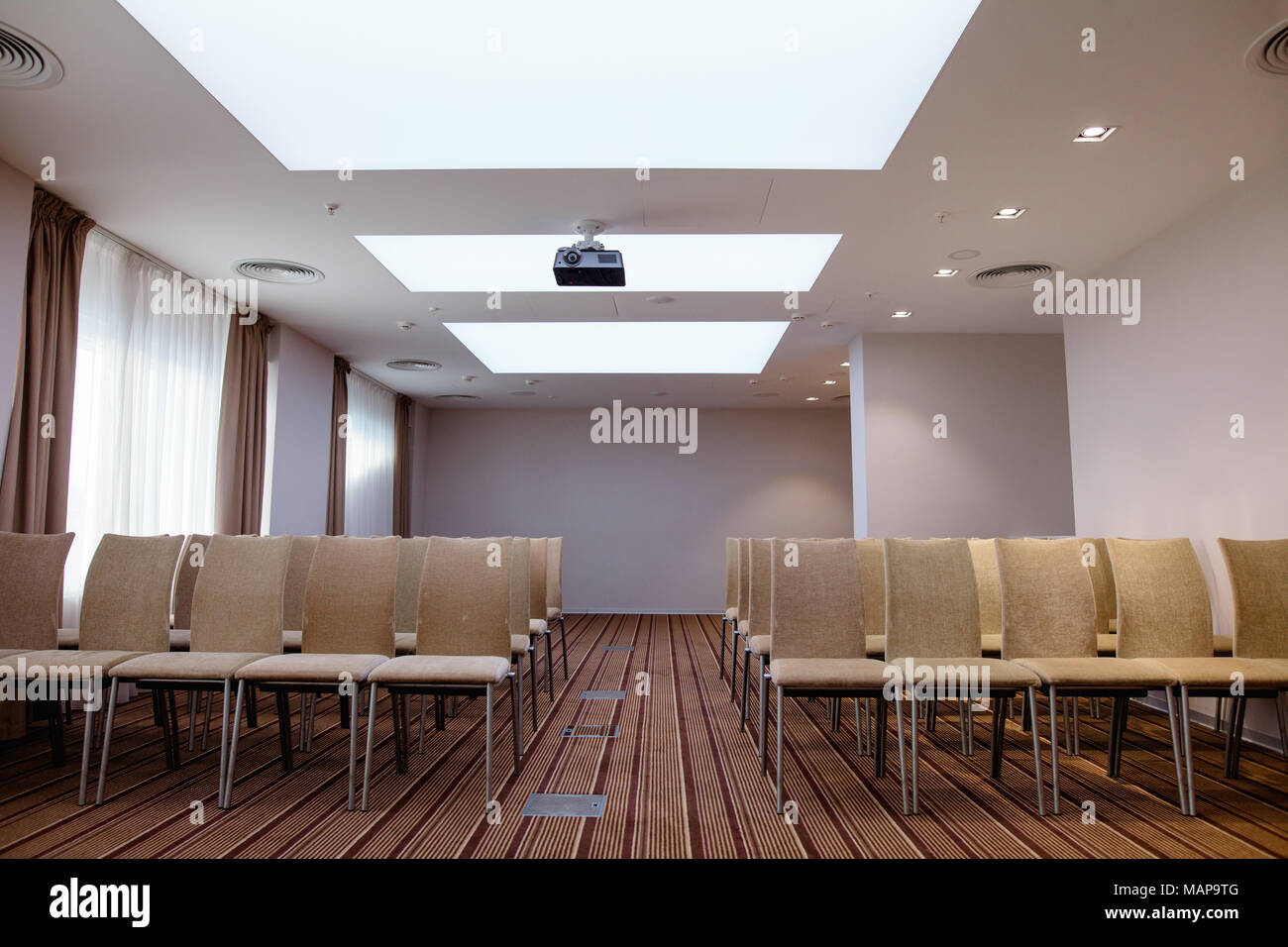 interior of assembly hall with costly chairs and carpet Stock Photo - Alamy