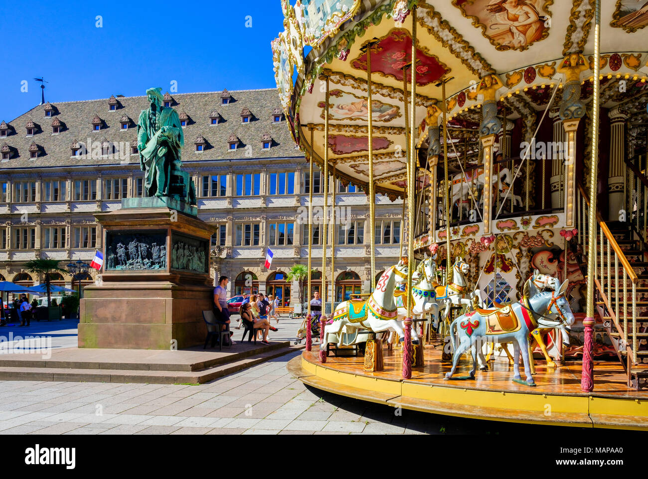 Merry-go-round, Gutenberg statue, Chamber of Commerce building, Place Gutenberg square, Strasbourg, Alsace, France, Europe, Stock Photo