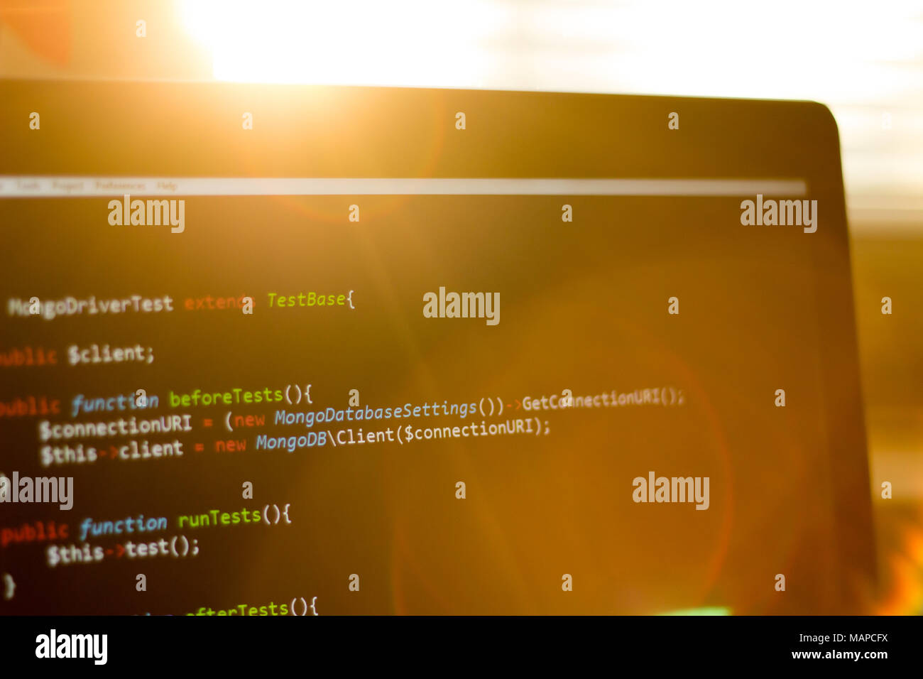 PHP code close up. Web development screen in sunset rays Stock Photo