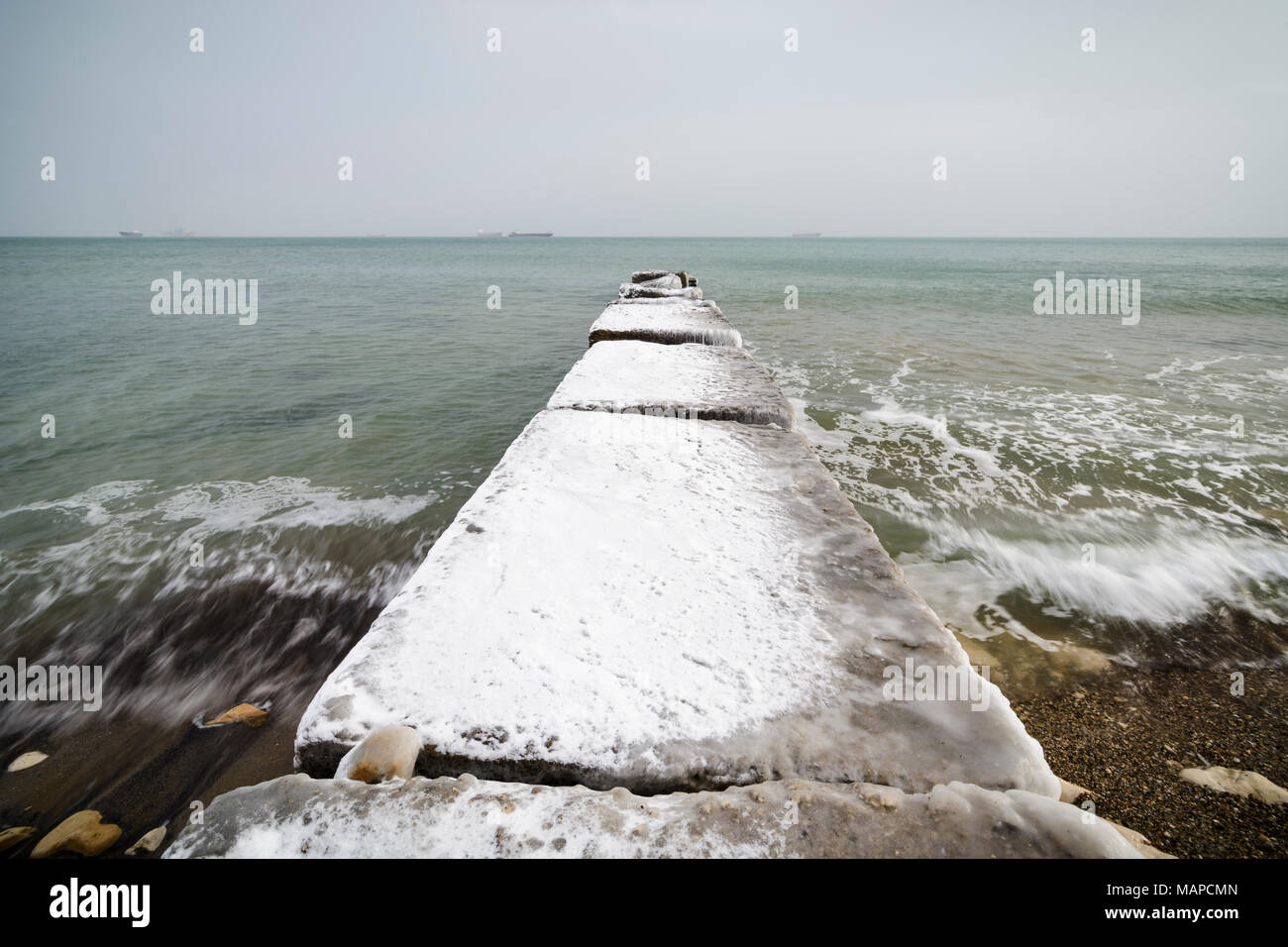 Concrete pier with ice and snow in Varna, Bulgaria Stock Photo Alamy