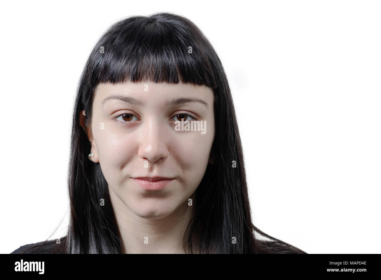Portrait of a young woman with pierced nose. Brown eyes. Stock Photo