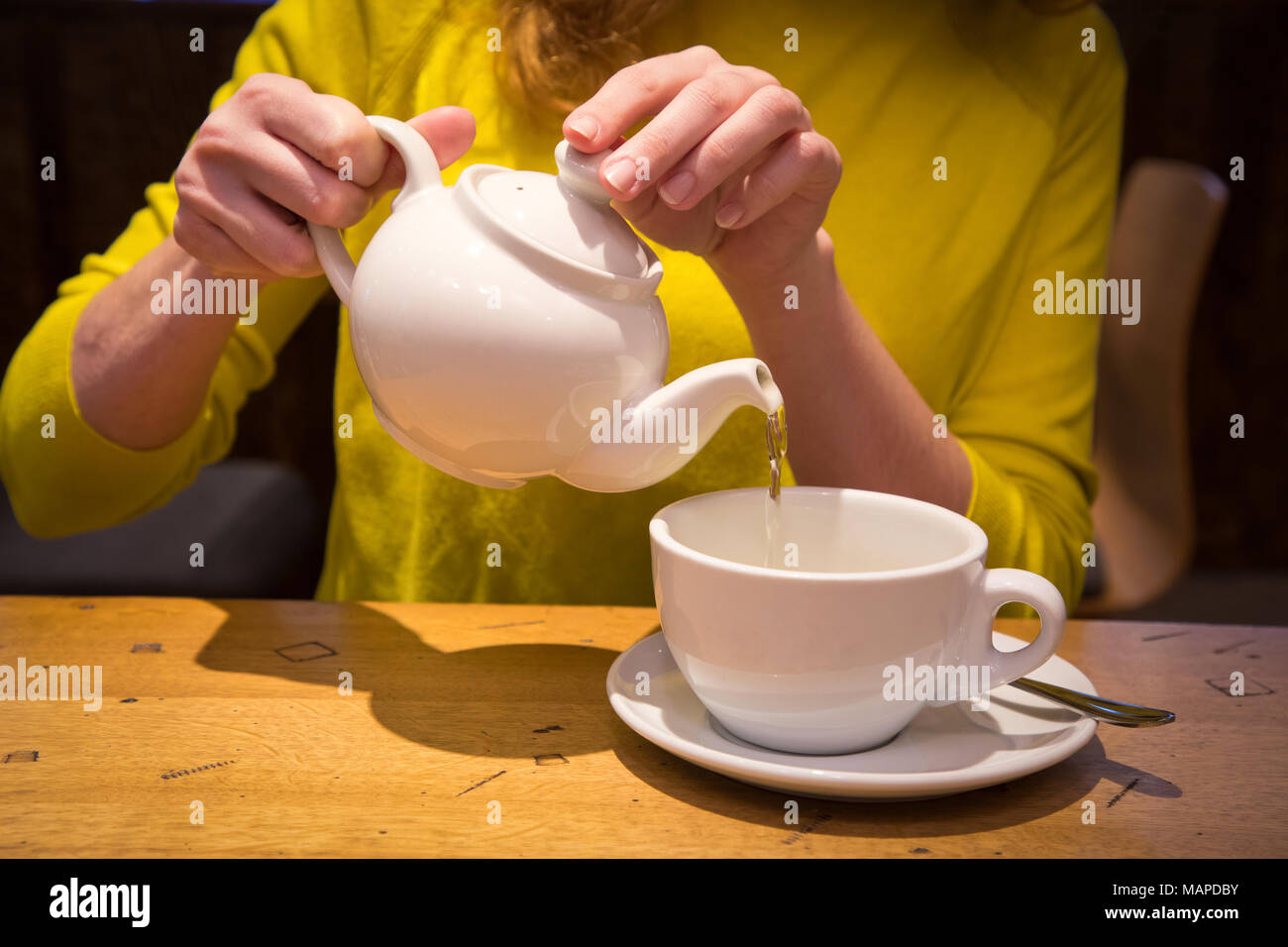 Pour Hot Water Into Tea Pot Stock Photos & Pour Hot Water Into Tea Pot