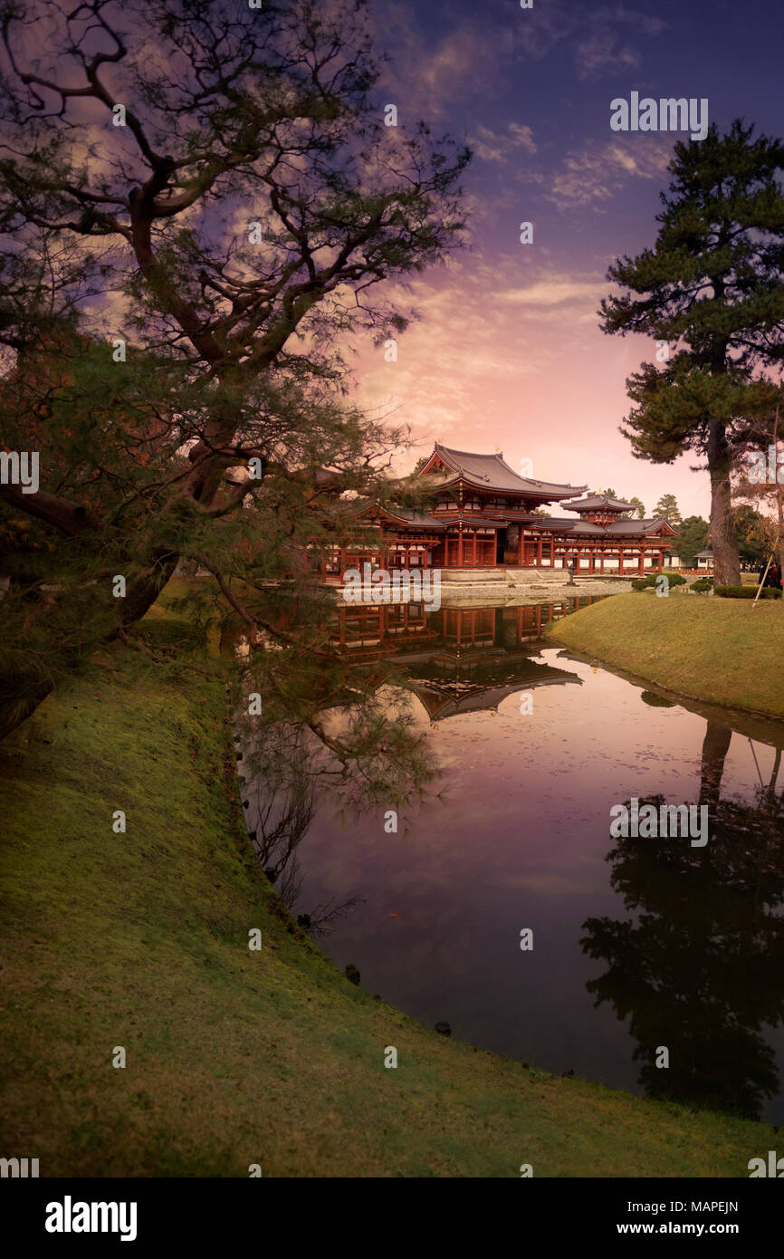 Jodo-shiki garden, Jodoshiki teien, Pure Land garden with a pond in front of the Phoenix Hall, Amida hall of Byodo-in Buddhist temple. Beautiful sunse Stock Photo