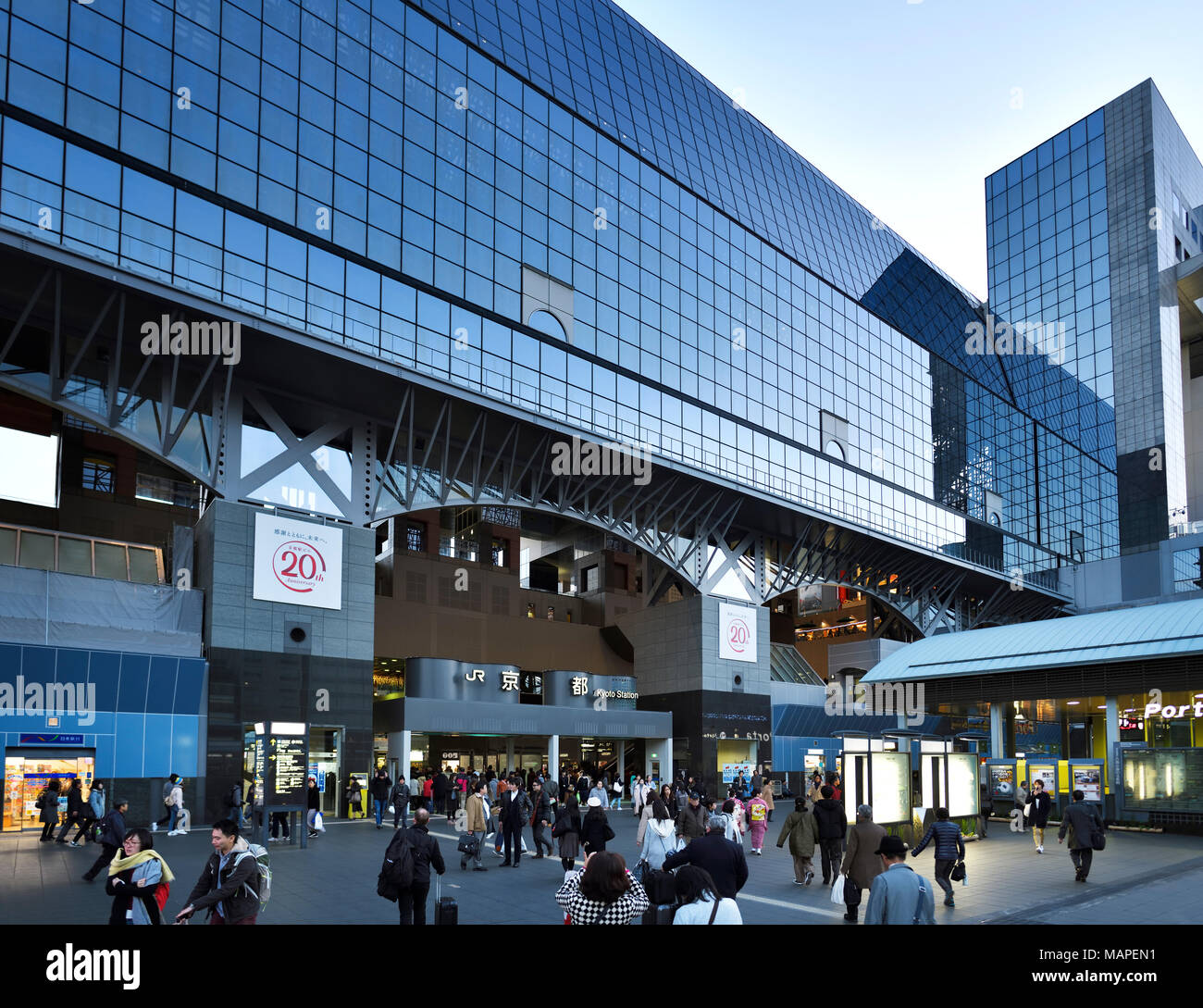 Kyoto Station, Kyoto-eki, modern glass building busy with people in the evening, second largest train station building in Japan. Shimogyo-ku, Kyoto, J Stock Photo