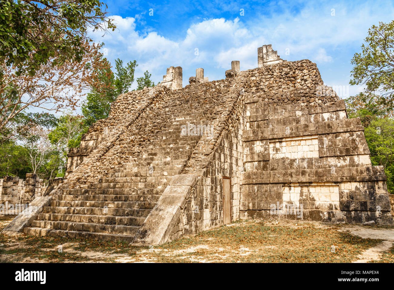 Small mayan pyramid in the forest, Chichen Itza archaeological site, Yucatan, Mexico Stock Photo