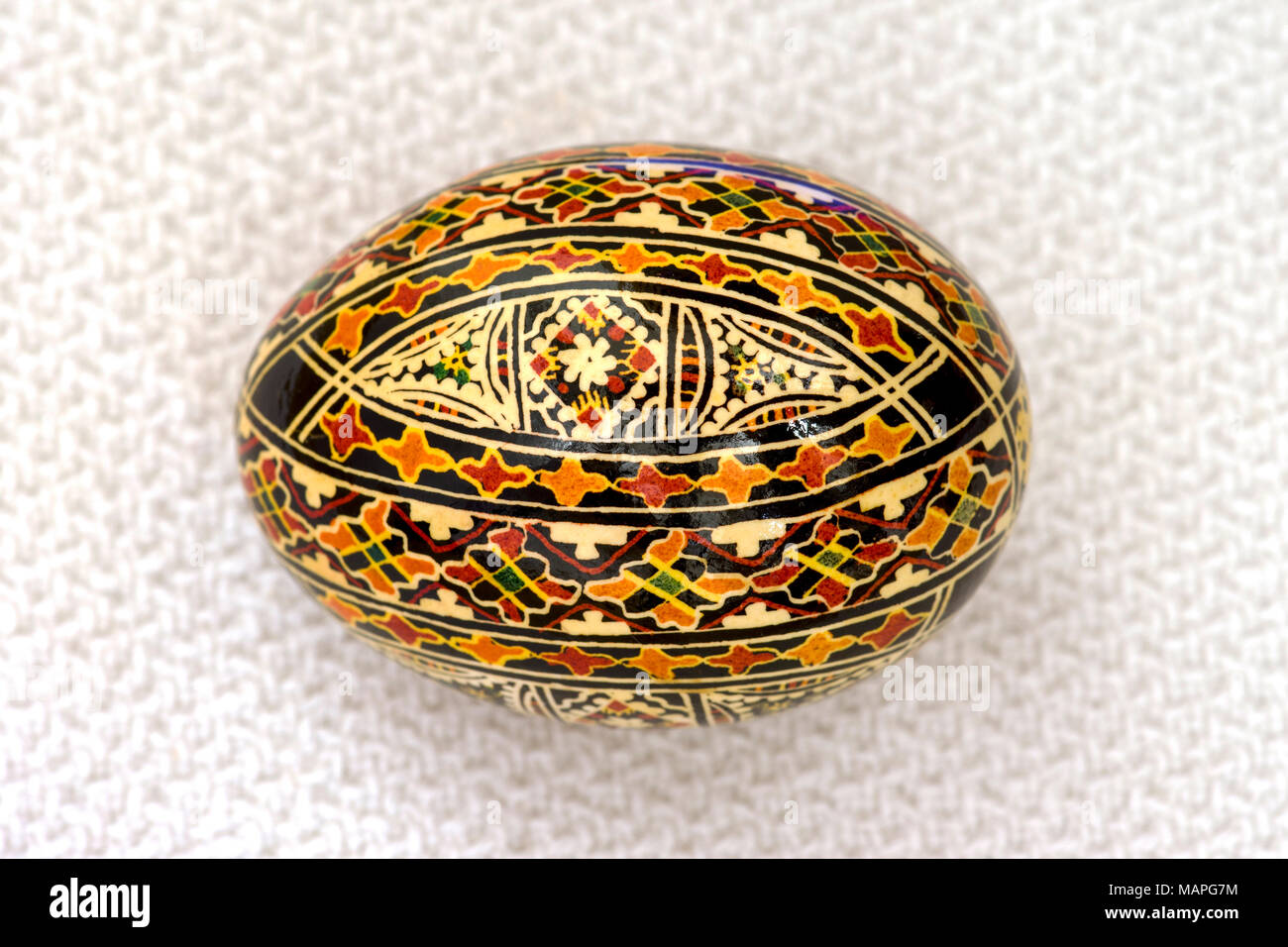 Pysanka (Ukrainian Easter egg), intricately inscribed. Stock Photo