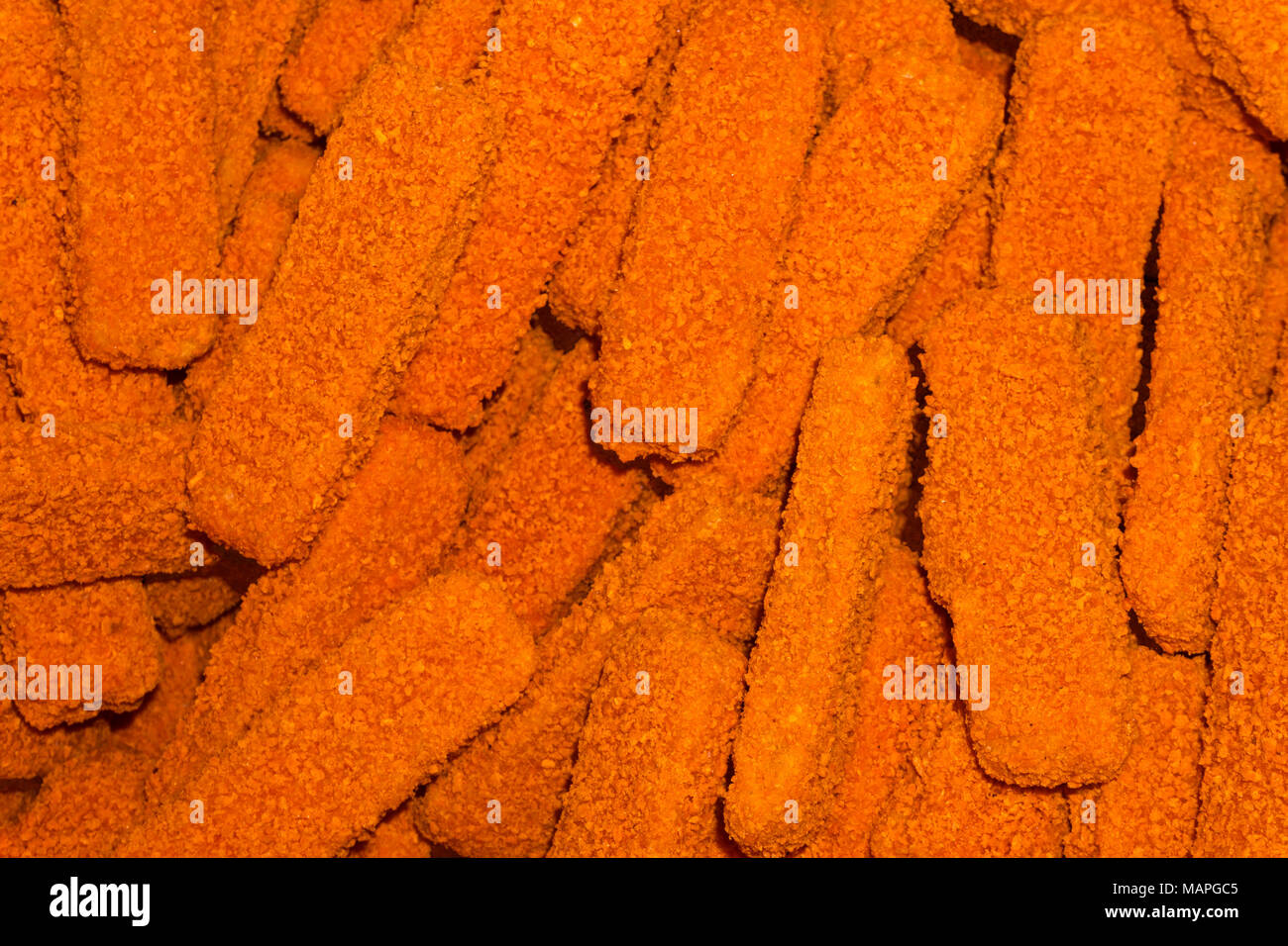 background - fish sticks in orange breading Stock Photo