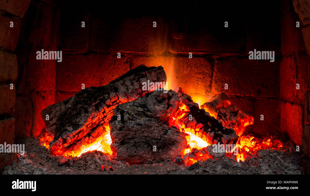 A fire burns in a fireplace Stock Photo Alamy
