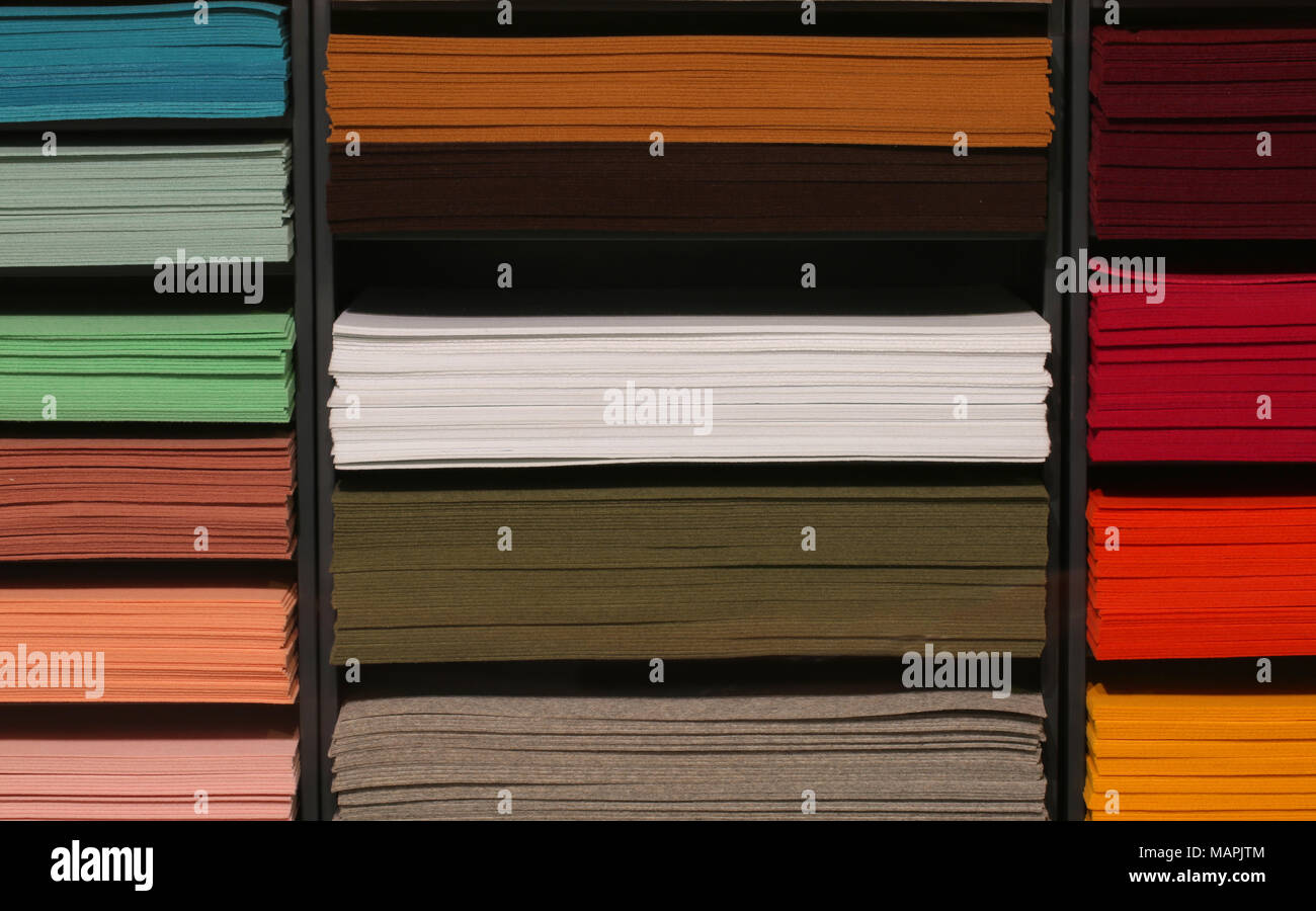 shelf with pieces of colored felt on sale in the haberdashery shop ...