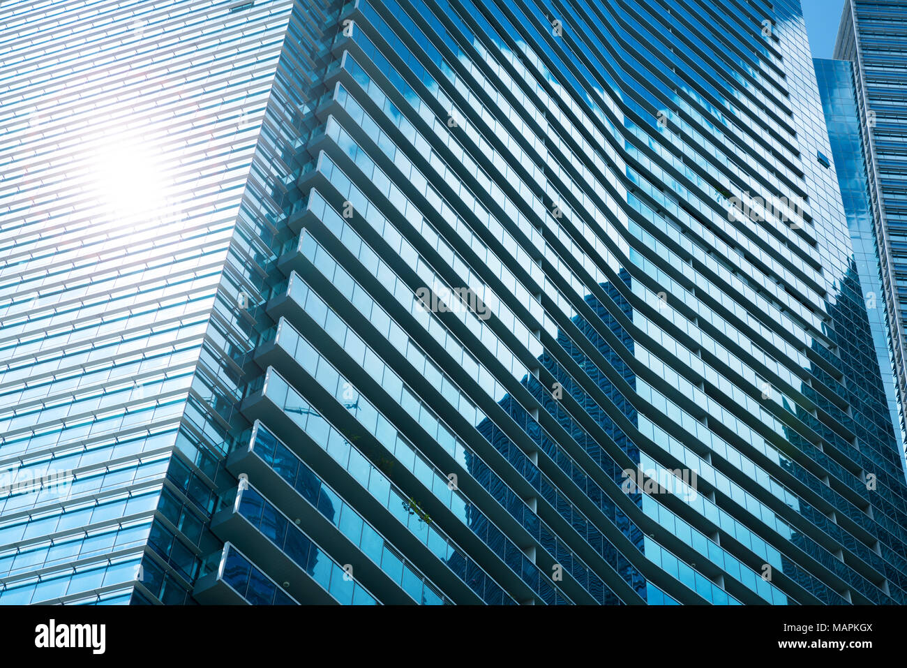 Glass facade of modern city high buildings, sun reflection lighting ...
