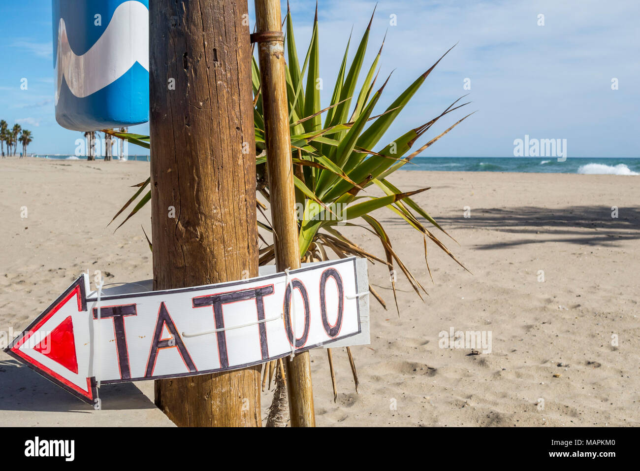 Mediterranean beach and tatoo sign. Stock Photo