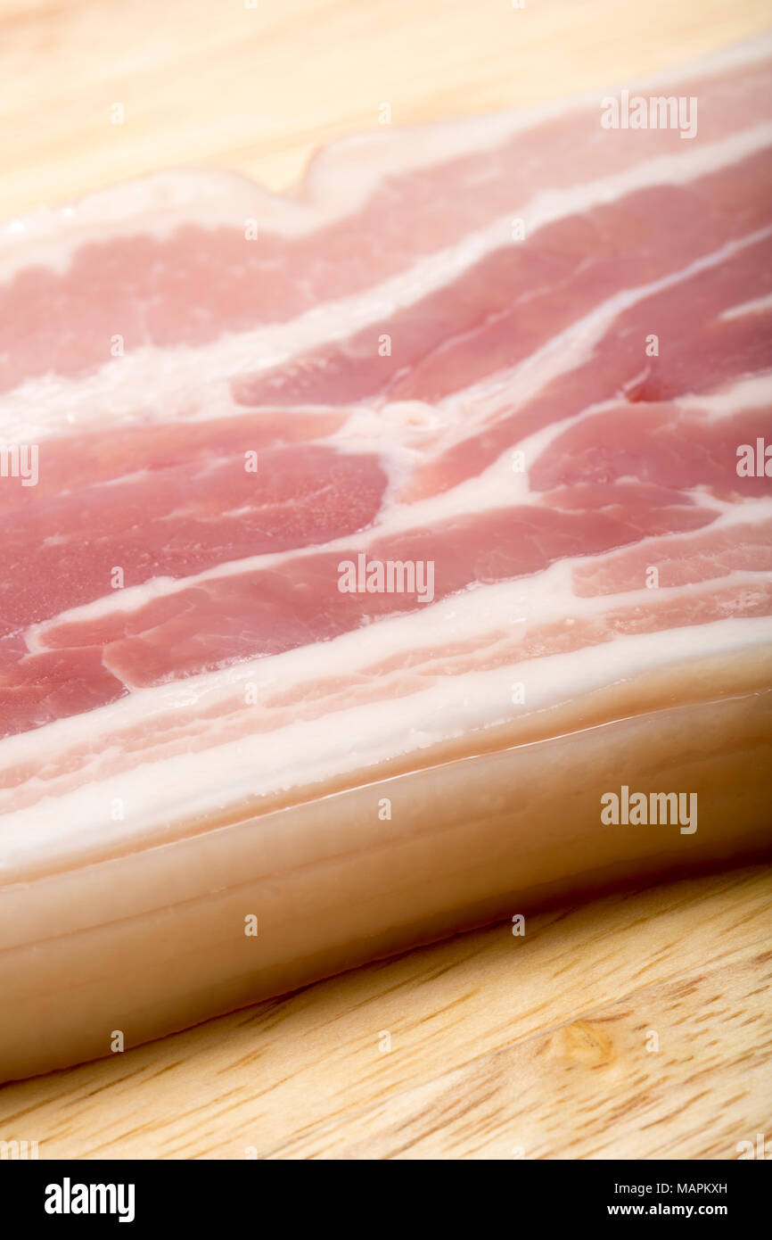 Unsmoked rashers of streaky bacon produced in the EU from a supermarket. Dorset England UK Stock Photo