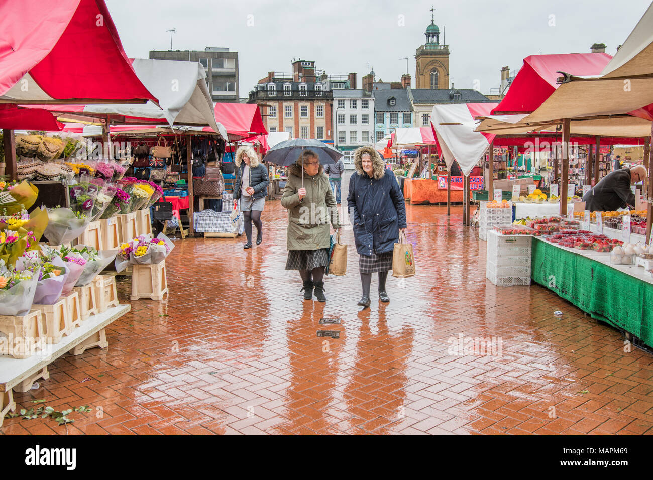 Stalls at Northampton's market square on a rainy day Stock Photo