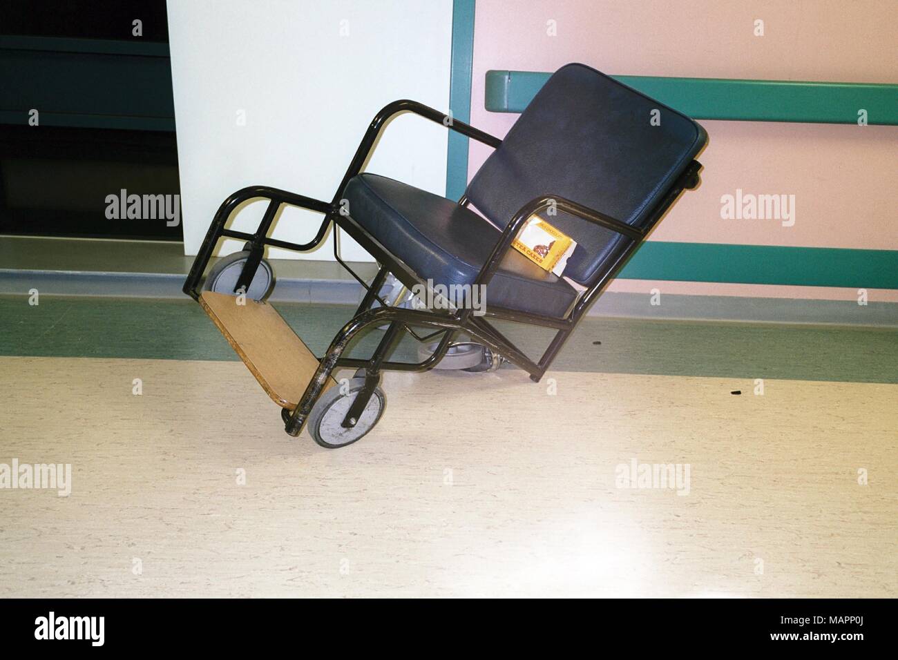 Broken wheelchair in a hospital corridor Stock Photo Alamy